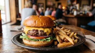 A cheeseburger and fries on a wooden table in a casual Middle Tennessee neighborhood pub during Mt. Juliet Burger Week (illustrative)